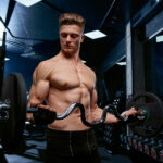shirtless-sportsman-training-biceps-with-barbell-scaled.jpg